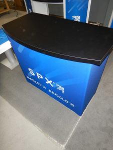 RENTAL: (1) RE-1558 Gravitee Reception Counter with SEG Fabric Wrap