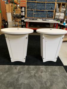 RENTAL: (2) RE-1201 Tapered Counters with White Laminated Finish, Locking Doors, and Interior Shelves. Includes Direct Print Sintra Graphics