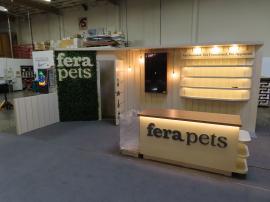 Custom Inline Exhibit with Halo Lit 3D Letters, Pendant Lights, Custom Reception Counter with Locking Storage, Acrylic Box, Shelves, Closet Storage, and Puck Lights -- View 3