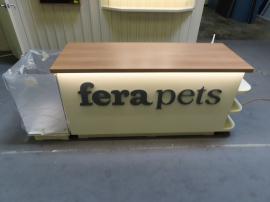 Custom Inline Exhibit with Halo Lit 3D Letters, Pendant Lights, Custom Reception Counter with Locking Storage, Acrylic Box, Shelves, Closet Storage, and Puck Lights -- View 4