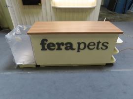 Custom Inline Exhibit with Halo Lit 3D Letters, Pendant Lights, Custom Reception Counter with Locking Storage, Acrylic Box, Shelves, Closet Storage, and Puck Lights -- View 5