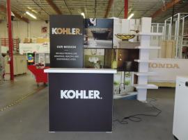 Custom Inline Exhibit with Fabric and Tension Fabric Graphics, Backlit Dimensional Logo, LED Lightbox, Waterfall Shelving Unit, and MOD-1726 Backlit Counter with Locking Storage -- View 2