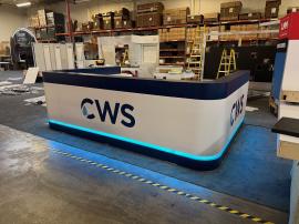 Custom U-shaped Bar with LED Lights, Electrical Outlets, and Locking Storage, Stage with RGB LED Lights, Hanging Circular Sign, MOD-1732 Genius Bar, and (4) ECO-8K Stands
