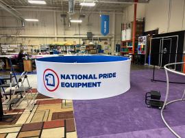 Custom U-shaped Bar with LED Lights, Electrical Outlets, and Locking Storage, Stage with RGB LED Lights, Hanging Circular Sign, MOD-1732 Genius Bar, and (4) ECO-8K Stands -- View 7