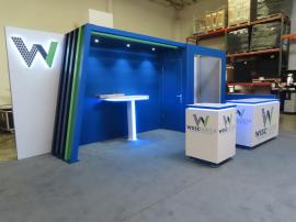 Custom Reconfigurable Gravitee Modular Exhibit with Halo Lit Dimensional Logo, Puck Lights, Backwall Charging Table, MOD-1593 Square Counter with LED Lights, and MOD-1599 Counter with LED Accent Lights