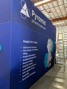 RENTAL: Island Design with L-Shaped Gravitee Panel System Backwall -- View 5